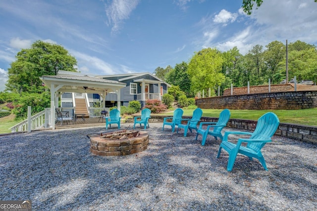22 Waters Bridge Cir, Covington, GA 30014 - view of patio featuring an outdoor fire pit