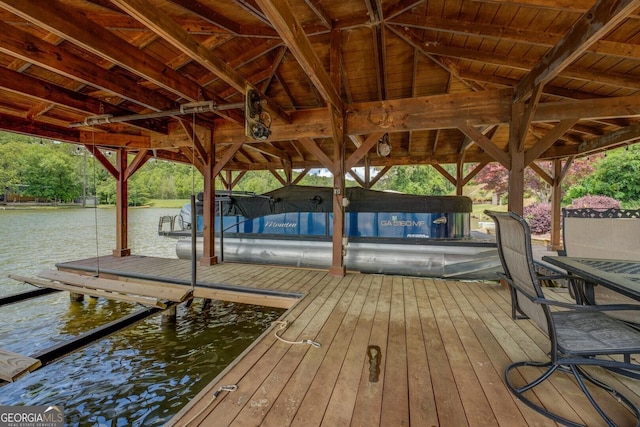 22 Waters Bridge Cir, Covington, GA 30014 - dock featuring boat lift and a water view