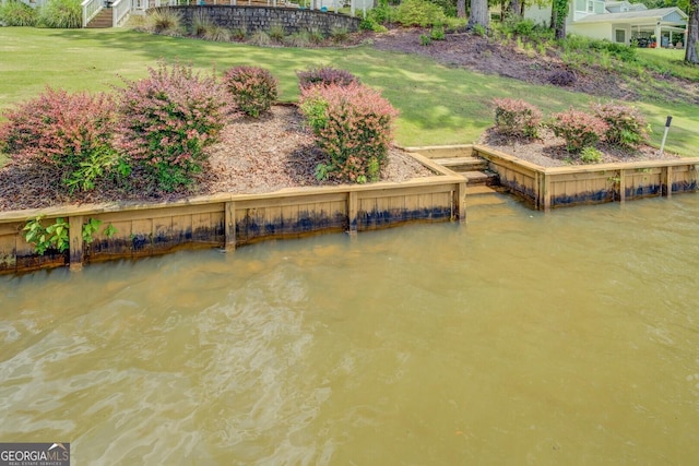 22 Waters Bridge Cir, Covington, GA 30014 - dock area with a lawn and a water view