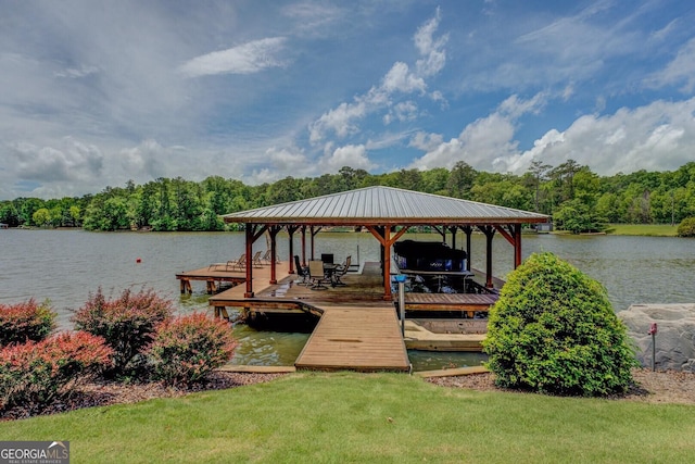 22 Waters Bridge Cir, Covington, GA 30014 - dock area featuring boat lift, a water view, a wooded view, and a lawn
