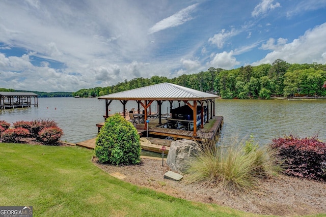 22 Waters Bridge Cir, Covington, GA 30014 - dock area featuring boat lift, a water view, and a lawn