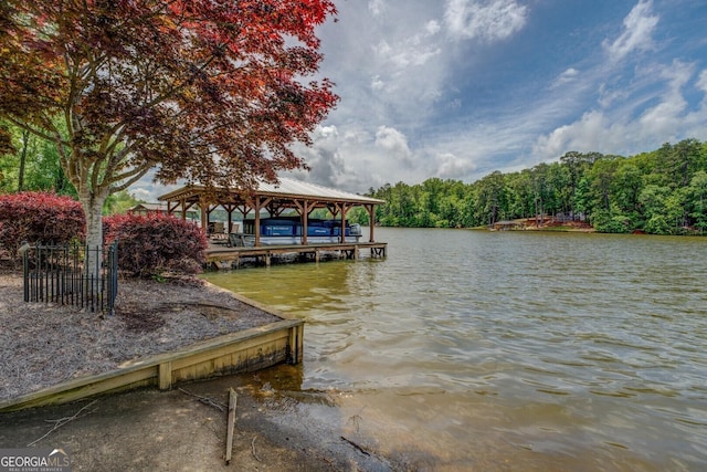 22 Waters Bridge Cir, Covington, GA 30014 - dock area featuring a water view and a view of trees
