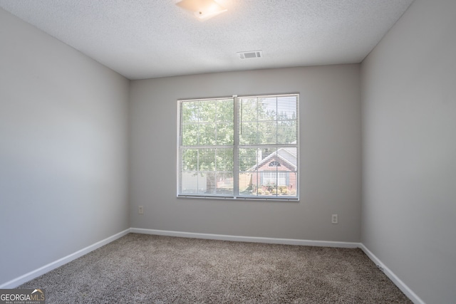 4915 Truitt Ln, Decatur, GA 30035 - empty room with carpet flooring and a textured ceiling