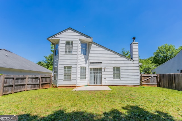 4915 Truitt Ln, Decatur, GA 30035 - back of property with a fenced backyard, a patio, and a chimney