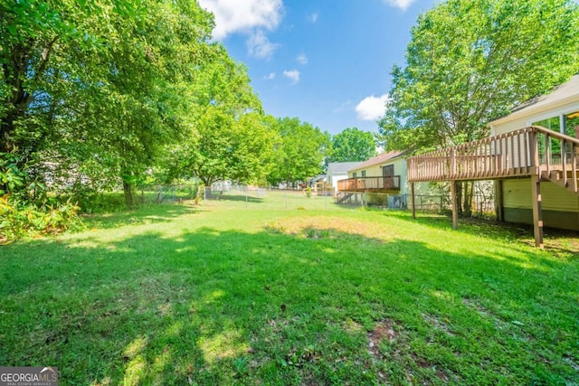 view of yard with a wooden deck