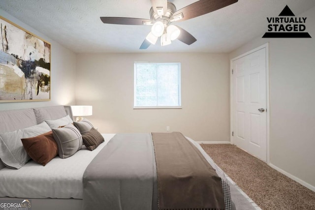 bedroom featuring carpet, baseboards, and a ceiling fan