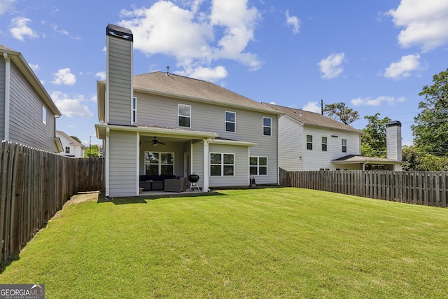 back of property featuring a ceiling fan, a chimney, and outdoor lounge area