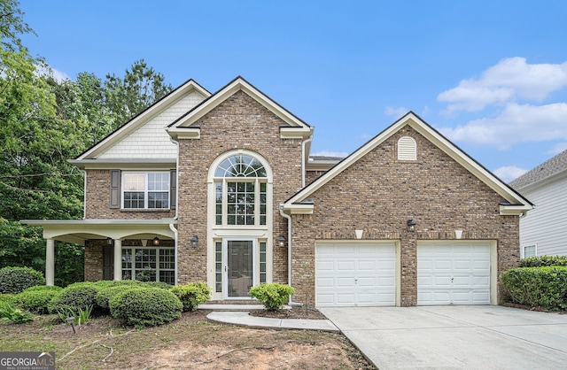 7280 Wright Dr, Atlanta, GA 30349 - traditional home featuring concrete driveway, a garage, and brick siding