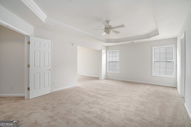 7280 Wright Dr, Atlanta, GA 30349 - carpeted empty room featuring a tray ceiling, ceiling fan, and crown molding