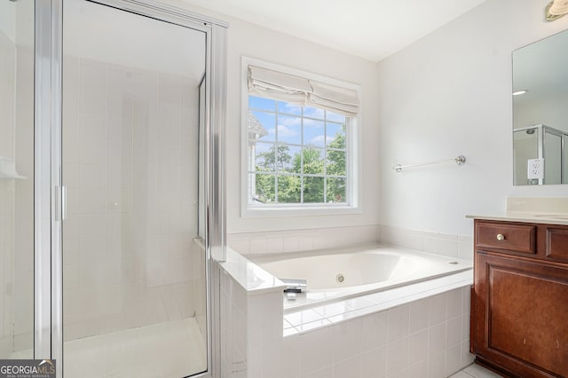 7280 Wright Dr, Atlanta, GA 30349 - bathroom featuring vanity, a whirlpool tub, and a shower stall