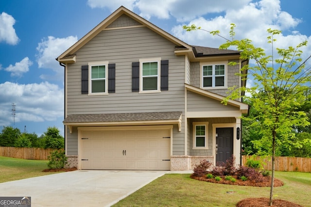 630 Evergreen Rd, Winder, GA 30680 - craftsman house featuring concrete driveway, an attached garage, and roof with shingles