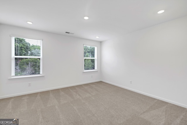 630 Evergreen Rd, Winder, GA 30680 - carpeted empty room featuring healthy amount of natural light, recessed lighting, and baseboards