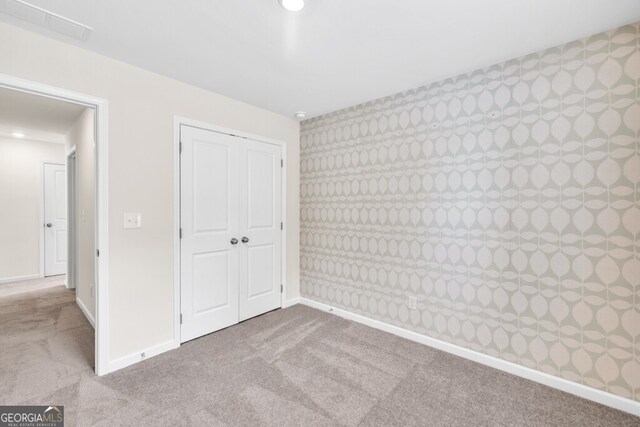 630 Evergreen Rd, Winder, GA 30680 - unfurnished bedroom with carpet floors, a closet, baseboards, and recessed lighting