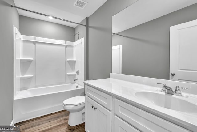 630 Evergreen Rd, Winder, GA 30680 - bathroom featuring wood finished floors, toilet, tub / shower combination, and vanity