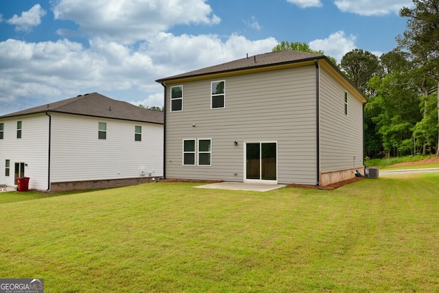 630 Evergreen Rd, Winder, GA 30680 - back of property with a patio area, a lawn, and central AC