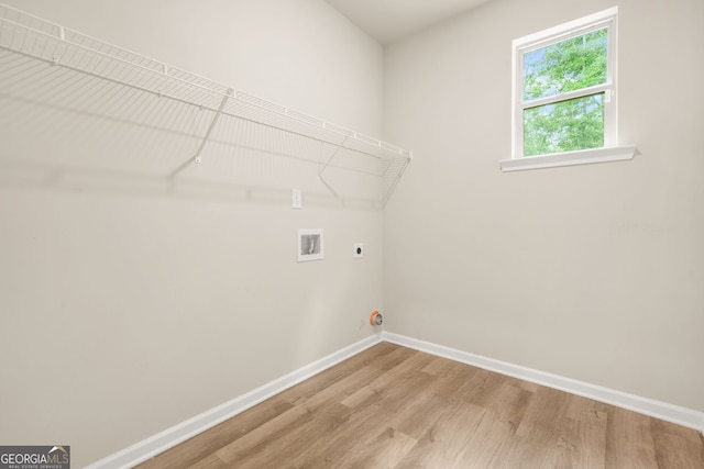 116 Cabin Way, Hampton, GA 30228 - laundry room featuring baseboards, hookup for an electric dryer, hookup for a washing machine, and light wood finished floors
