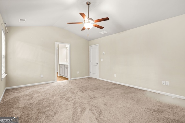 116 Cabin Way, Hampton, GA 30228 - spare room with a ceiling fan, light colored carpet, lofted ceiling, and baseboards