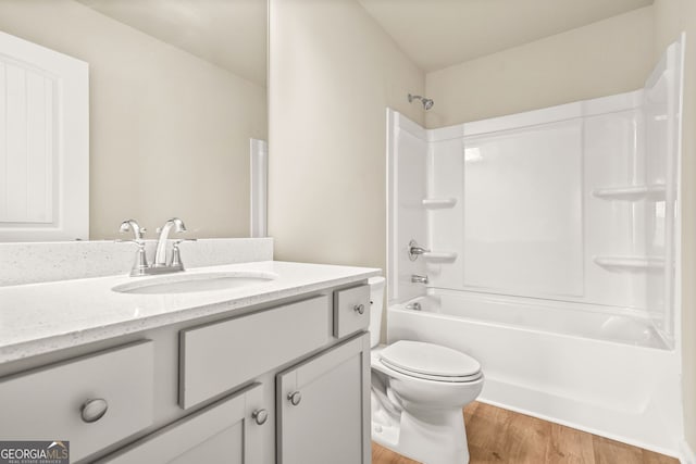 116 Cabin Way, Hampton, GA 30228 - bathroom featuring wood finished floors, toilet, vanity, and tub / shower combination
