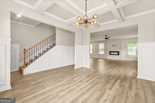 116 Cabin Way, Hampton, GA 30228 - unfurnished living room featuring stairway, coffered ceiling, light wood-type flooring, beam ceiling, and a chandelier