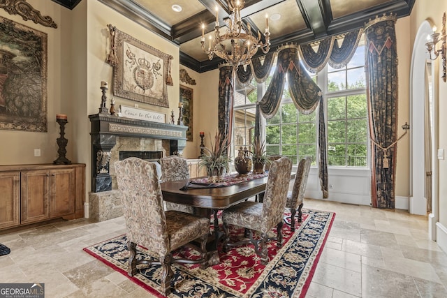 dining room featuring crown molding, stone tile flooring, plenty of natural light, a chandelier, and beam ceiling
