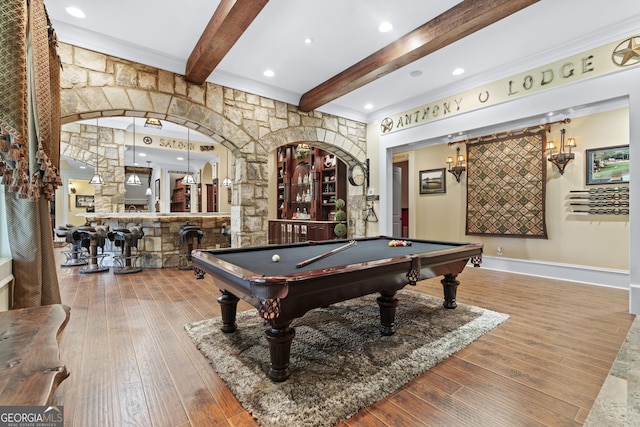 playroom with beamed ceiling, wood-type flooring, a community bar, billiards, and arched walkways