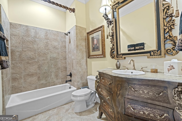 bathroom featuring toilet, vanity, tile patterned floors, and shower / washtub combination