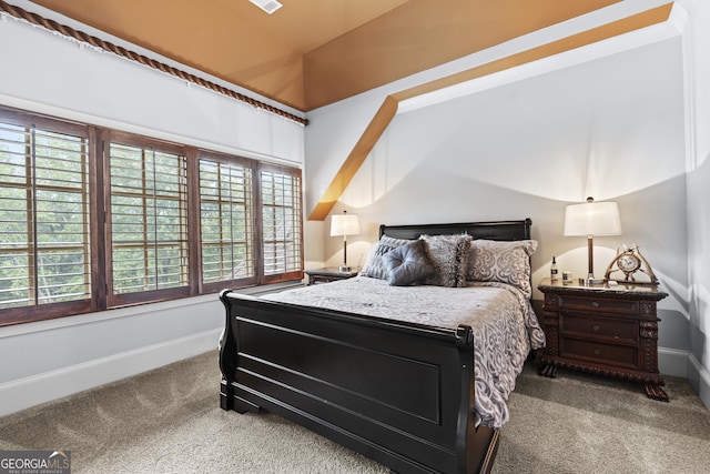 carpeted bedroom with multiple windows and baseboards