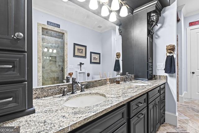 bathroom with a shower stall, double vanity, ornamental molding, baseboards, and toilet