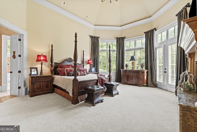 bedroom featuring access to outside, light carpet, crown molding, and high vaulted ceiling