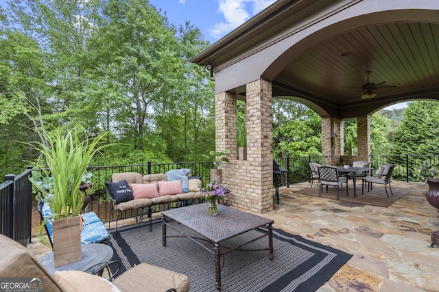 view of patio with outdoor dining area, an outdoor hangout area, and ceiling fan