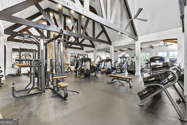 gym with a ceiling fan, high vaulted ceiling, and beam ceiling