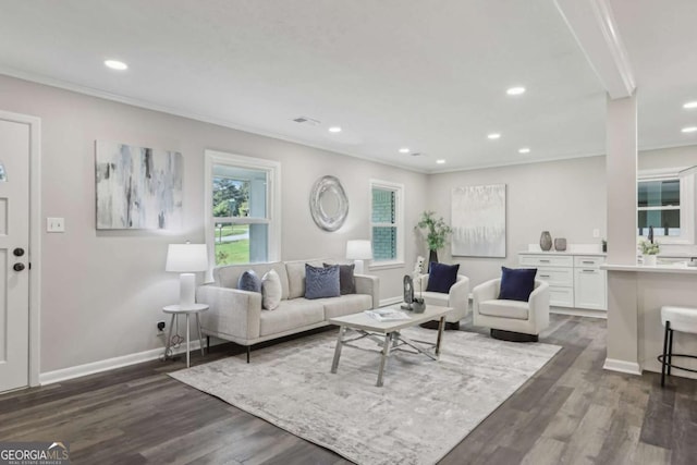 living room featuring dark wood-style flooring, recessed lighting, baseboards, and crown molding