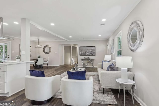 living area with dark wood finished floors, recessed lighting, baseboards, and a chandelier