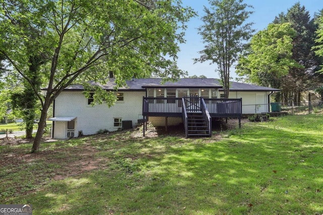 back of house featuring a deck and brick siding