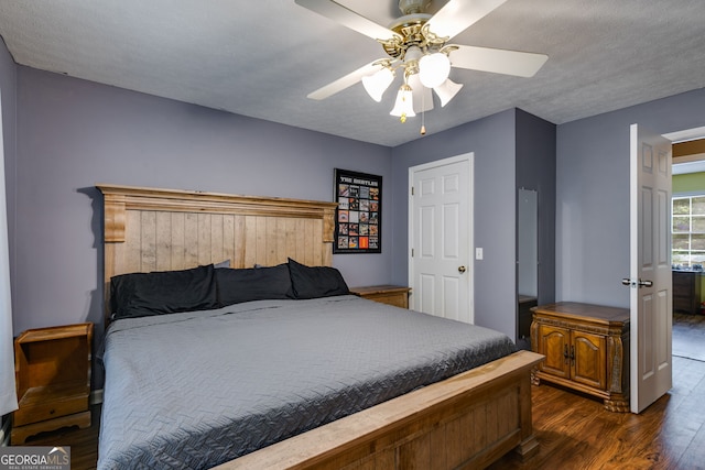 760 Poseyville Rd, Bremen, GA 30110 - bedroom with wood finished floors, a ceiling fan, and a textured ceiling