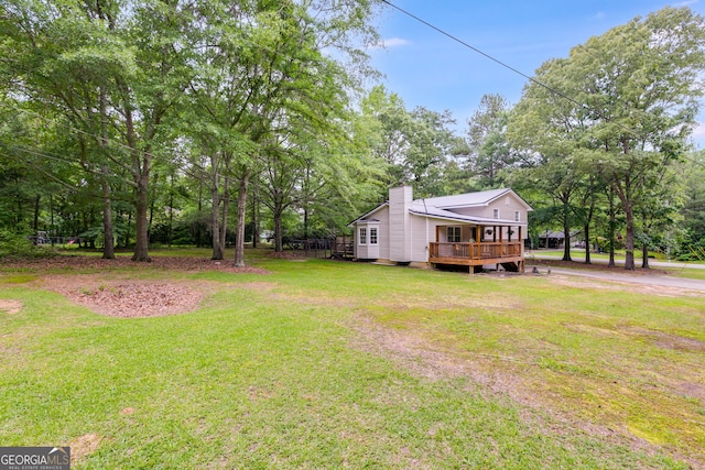 760 Poseyville Rd, Bremen, GA 30110 - view of grassy yard featuring a deck and view of scattered trees