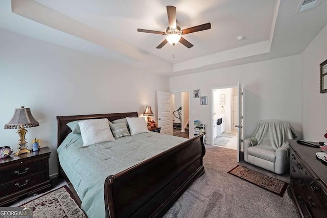 2209 Cedar Place Ct, Snellville, GA 30078 - bedroom featuring a tray ceiling, carpet floors, and a ceiling fan