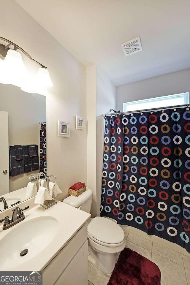 2209 Cedar Place Ct, Snellville, GA 30078 - bathroom with tile patterned floors, vanity, toilet, and curtained shower