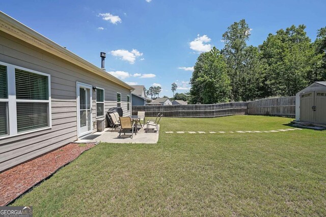 2209 Cedar Place Ct, Snellville, GA 30078 - view of yard featuring a shed, a patio, and an outbuilding