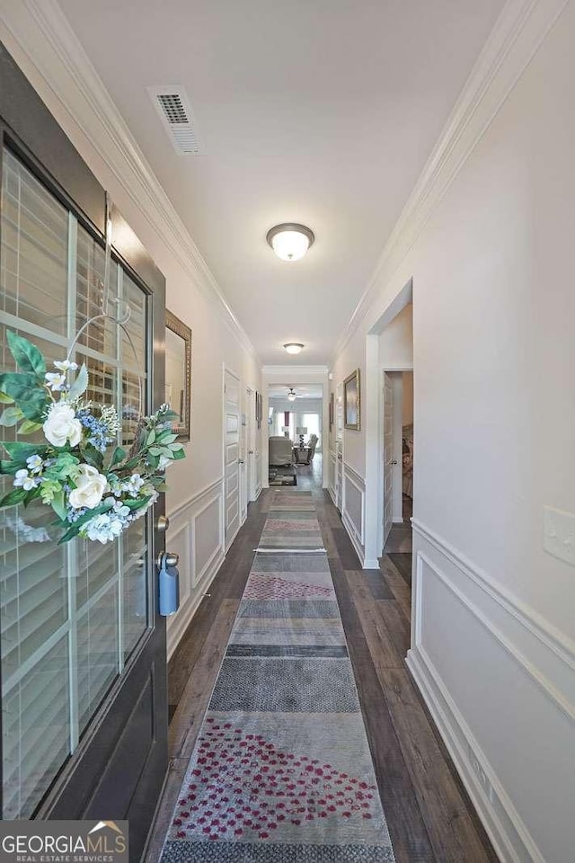 2209 Cedar Place Ct, Snellville, GA 30078 - corridor with ornamental molding, a decorative wall, wood finished floors, and wainscoting