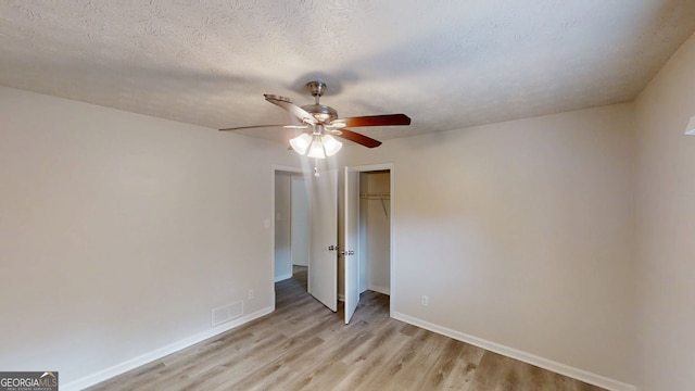 3512 Valley Chase Ct, Lithonia, GA 30038 - unfurnished bedroom with light wood-style floors, baseboards, a closet, and ceiling fan