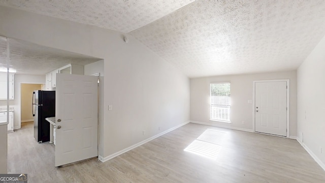 3512 Valley Chase Ct, Lithonia, GA 30038 - unfurnished room featuring light wood-style floors, a textured ceiling, and baseboards