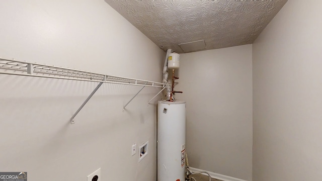 3512 Valley Chase Ct, Lithonia, GA 30038 - laundry room featuring gas water heater, hookup for a washing machine, electric dryer hookup, attic access, and a textured ceiling