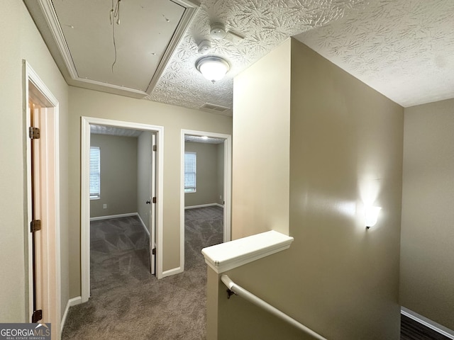 9151 Jefferson Village Dr SW, Covington, GA 30014 - corridor with attic access, dark carpet, and baseboards