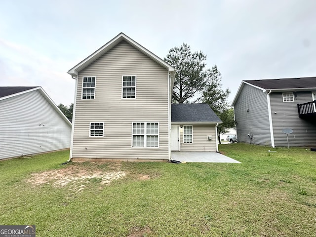 9151 Jefferson Village Dr SW, Covington, GA 30014 - back of property with a patio area and a lawn