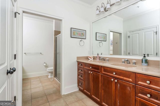 bathroom with ornamental molding, a shower stall, vanity, tile patterned floors, and toilet