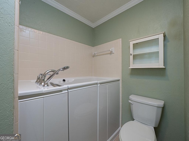 bathroom with crown molding and toilet