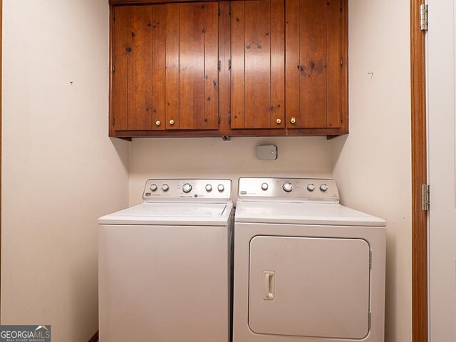 laundry room featuring cabinet space and independent washer and dryer