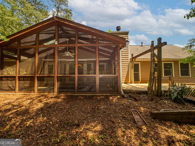 rear view of property with a sunroom