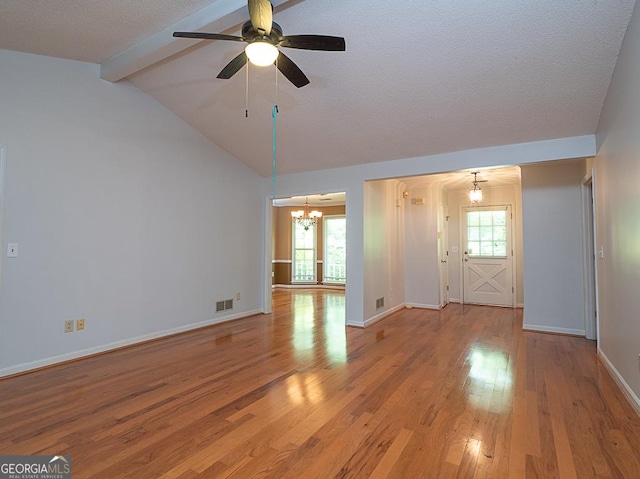 unfurnished living room with a chandelier, wood finished floors, a ceiling fan, baseboards, and a textured ceiling